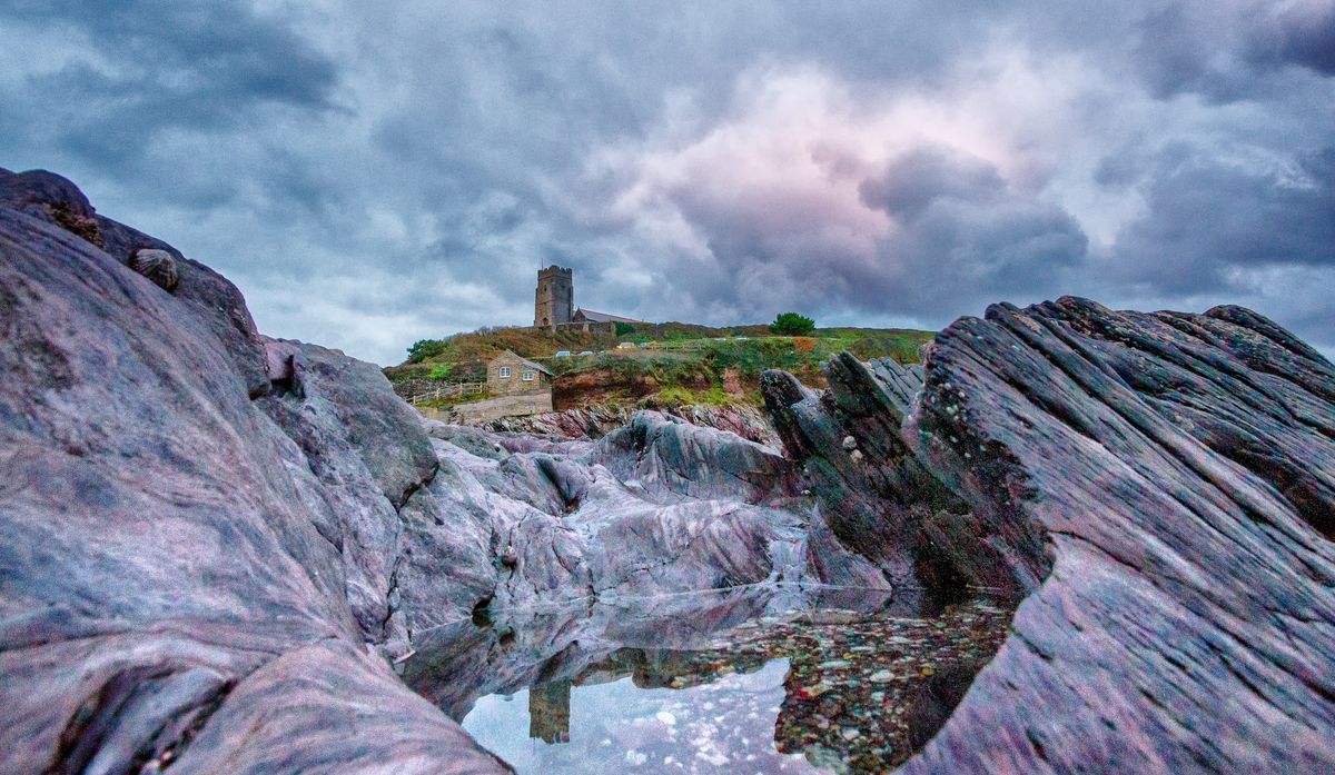 VILLAGE CHURCH REFLECTED IN ROCK POOL